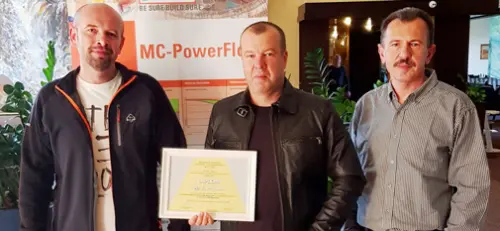 The MC team of Martin Struk, Michal Lehký and Milan Řičica (from left to right) proudly show off the certificate for first place in the SAVT competition for the strongest UHPC concrete. 