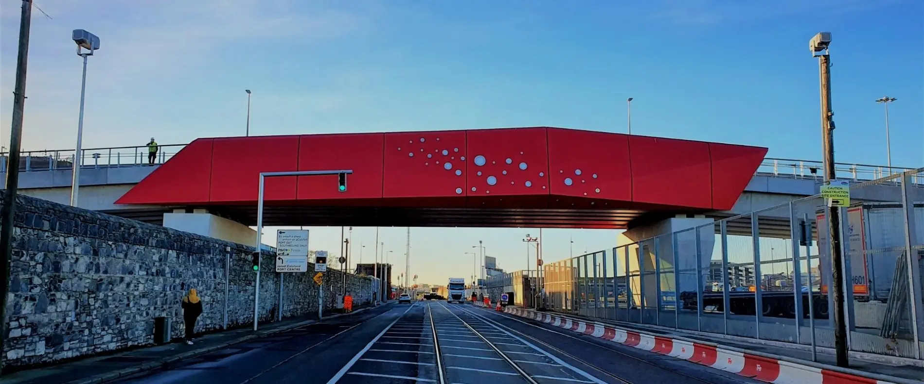 The bold red of the bridge matches the Poolbeg lighthouse in Dublin Bay.